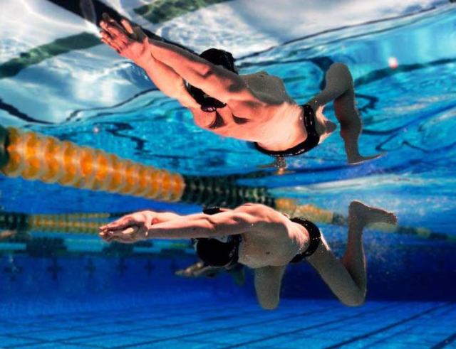 This is a man swimming completely under water.