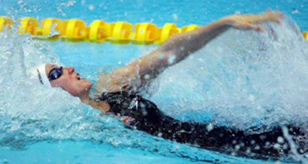This is a lady competing in a backstroke event.